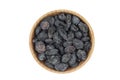 Black raisins in a wooden bowl Royalty Free Stock Photo