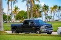 Black Ram 3500 pick up truck parked by a grass field Royalty Free Stock Photo