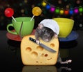 Rat cook cuts cheese on table 2 Royalty Free Stock Photo