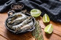 Black raw tiger prawns, shrimps in a pan. wooden background. Top view Royalty Free Stock Photo