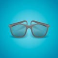 Black realistic glasses isolated on blue background.