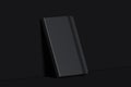 Black realistic notepad isolated on dark background. 3d rendering.