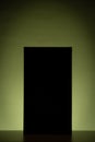 Black rectangle with green gradient background lighting