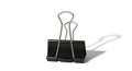 A black rectangular binder clip with silver metal clips on a plain white background showing a subtle shadow in the bottom right Royalty Free Stock Photo
