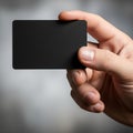 A black rectangular card with rounded corners against a blurred Royalty Free Stock Photo
