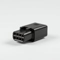A black rectangular electrical connector with eight square pins is visible. The connecto Royalty Free Stock Photo