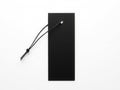 Black rectangular object with attached cord on white background Royalty Free Stock Photo