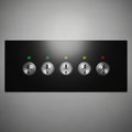 A black rectangular panel features five metal toggle switches arranged in a row. Royalty Free Stock Photo