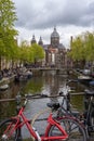 Bikes over the bridge in amsterdam canal Royalty Free Stock Photo