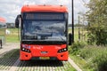 Black and red bus runned by RET in R-NET colors