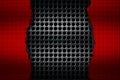 Black and red carbon fiber tear on the black metallic mesh. Royalty Free Stock Photo