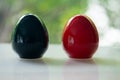Black and red of egg shape ceramic shakers for salt or pepper Royalty Free Stock Photo