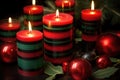 black, red, and green banded candles for the kinara