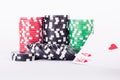 Black, red and green casino chips isolated on white Royalty Free Stock Photo