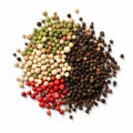 Black, red, green, white and allspice peppercorns isolated on white background Royalty Free Stock Photo