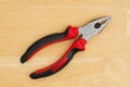 A black and red hand pliers