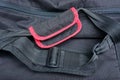 Black red handles and harnesses made of cloth on a backpack Royalty Free Stock Photo