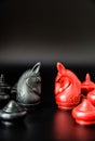 Black and Red Knight Thai chess piece challenge on black background and selective focus Royalty Free Stock Photo