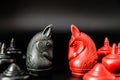 Black and Red Knight Thai chess piece challenge on black background and selective focus Royalty Free Stock Photo