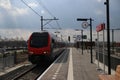 black red local commuter train from Gouda at station Waddinxveen Triangel in the Netherlands