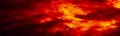 Black red orange sky with clouds. Fire and smoke effect. Night. Dramatic skies background with space for design. Web banner. Royalty Free Stock Photo