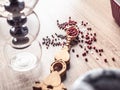 Black and red pepper on a vintage spoon. Variety of spices on wooden kitchen table. Top view Royalty Free Stock Photo