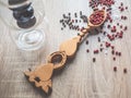 Black and red pepper on a vintage spoon. Variety of spices on wooden kitchen table. Top view Royalty Free Stock Photo