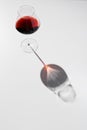 Black and red reflection of wineglass on thin stem. Royalty Free Stock Photo