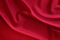 Black red satin dark fabric texture luxurious shiny that is abstract silk cloth background with patterns. Royalty Free Stock Photo