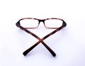 Black and red striped horn-rimmed glasses on white background Royalty Free Stock Photo