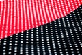 Black and red tisuue with white polka dots