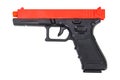 Black and red toy gun on a white background, isolated image Royalty Free Stock Photo