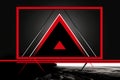 a black and red triangle on a dark background Royalty Free Stock Photo