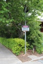 black, red and white Danger - Look Out For Moving Vehicles warning sign at the exit of a car park Royalty Free Stock Photo