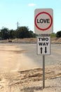 Black, red and white Love, Two Way street sign with arrows Royalty Free Stock Photo