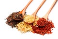 Black, red and white quinoa grains in a wooden spoon isolated on white background. Chenopodium quinoa Royalty Free Stock Photo