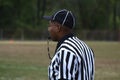 Black referees a game at a high school football