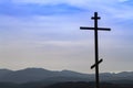 Black religion symbol silhouette Jesus Christ wooden cross on a background with colorful mountain sunset, Easter concept Royalty Free Stock Photo