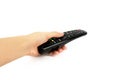 Black remote control in hand isolated on white background Royalty Free Stock Photo