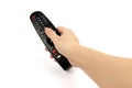 Black remote control in hand isolated on white background Royalty Free Stock Photo