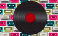 Black retro, hipster, old, old, musical antique vinyl record against a background of multi-colored audio cassettes. Royalty Free Stock Photo