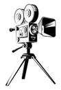 Black retro movie camera on a tripod Royalty Free Stock Photo