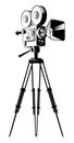 Black retro movie camera on a tripod Royalty Free Stock Photo