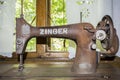 Black retro sewing machine in an old house