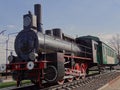 Black retro steam train with green car Royalty Free Stock Photo