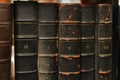 Black retro worn books on a shelf in the library Royalty Free Stock Photo