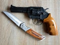 Black revolver pistol with knife