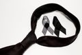 Black ribbon and black necktie; decoration black ribbon hand made artistic design for sadness expression isolated on white Royalty Free Stock Photo