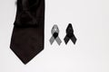 Black ribbon and black necktie; decoration black ribbon hand made artistic design for sadness expression isolated on white Royalty Free Stock Photo