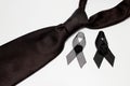 Black ribbon and black necktie; decoration black ribbon hand made artistic design for sadness expression isolated on white Royalty Free Stock Photo